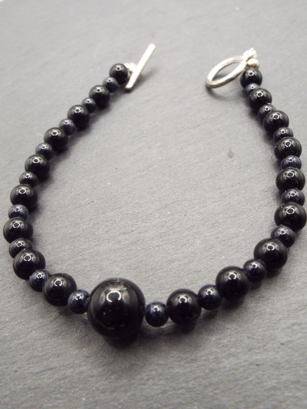 BLACK ONYX 5MM BEADS W/ 9.5MM BEAD SIMPLE SOPHISTICATED BRACELET 42